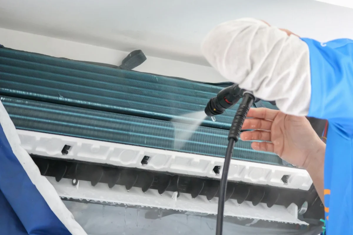 Air conditioner being professionally cleaned